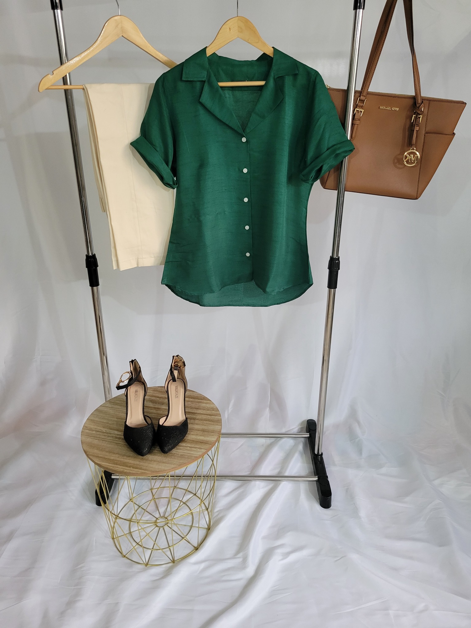 Customized green blouse with ivory trousers
