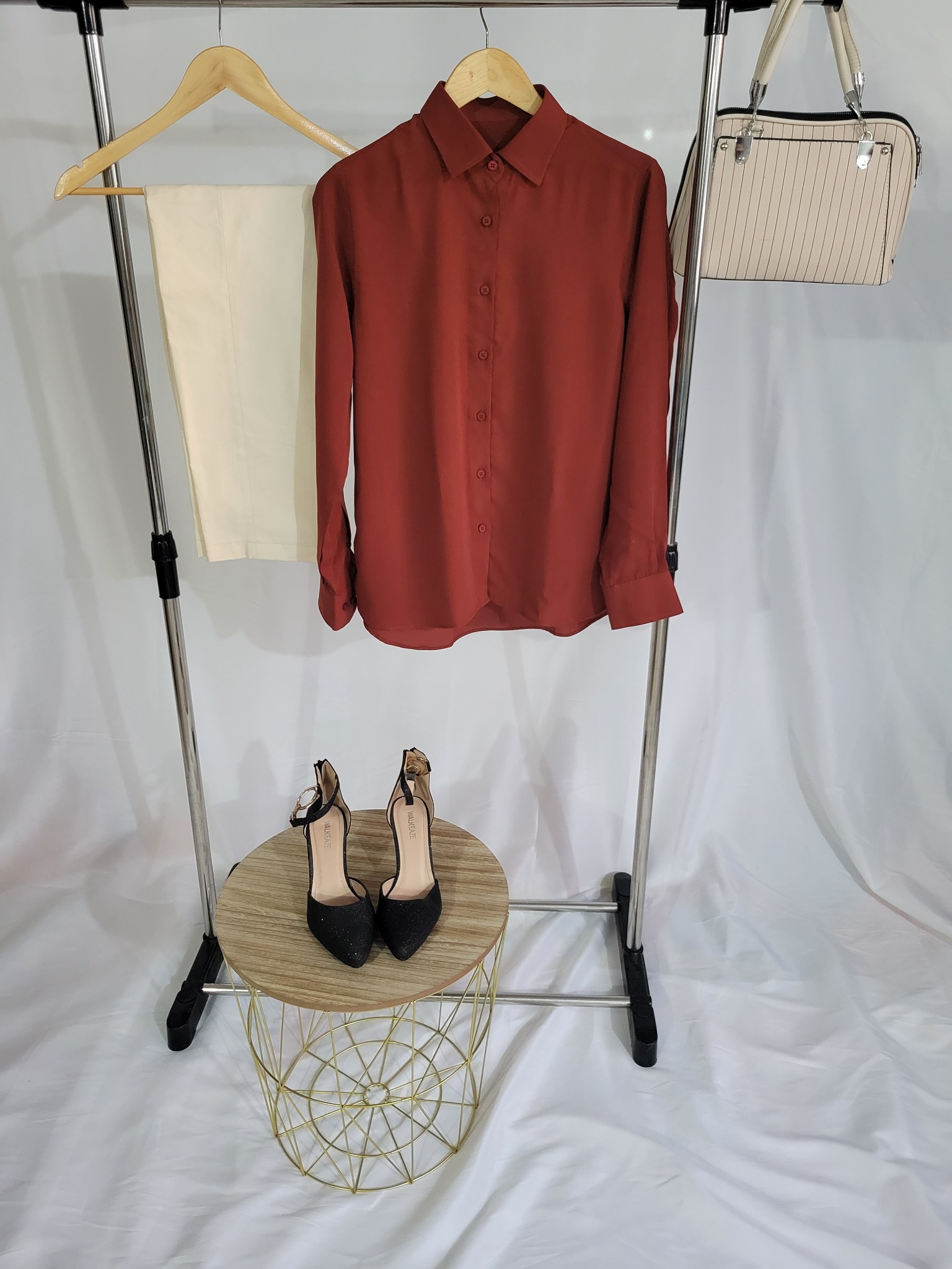 Customized terracotta blouse with ivory trousers