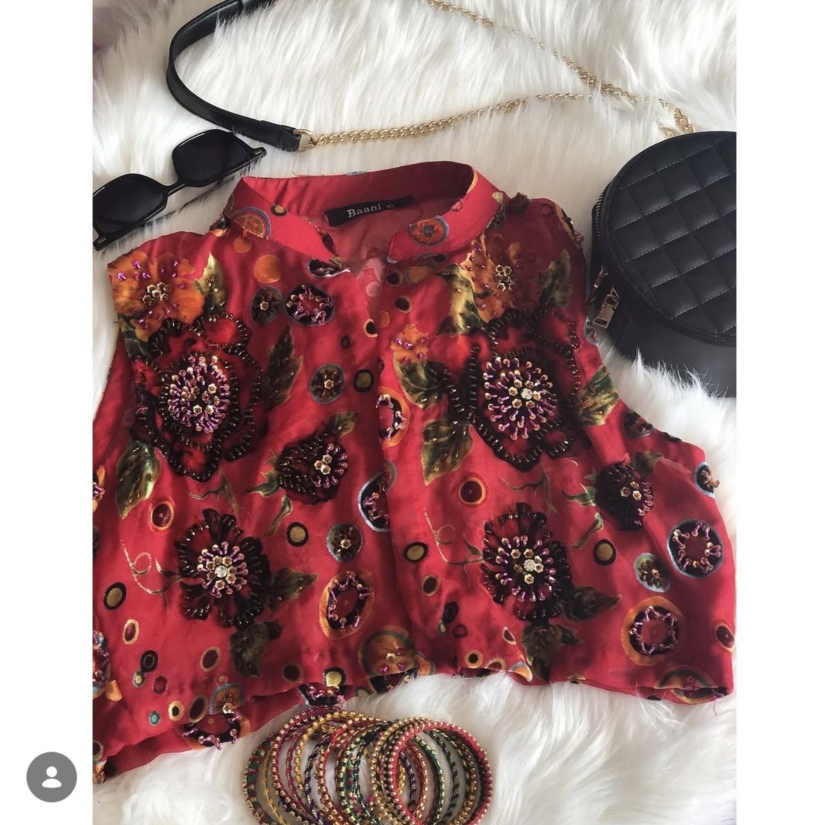 Baani red embellished product flatlay